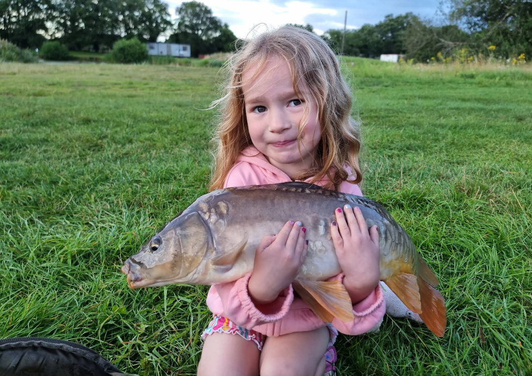 Cute-girl-holding-fish